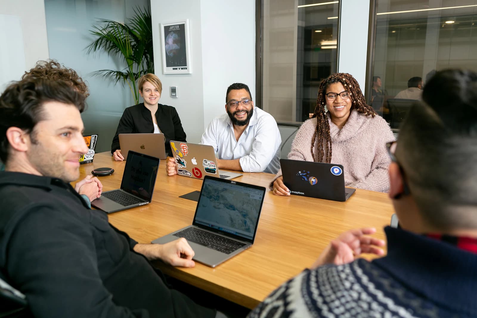 A real team collaborating — relevant to enterprise